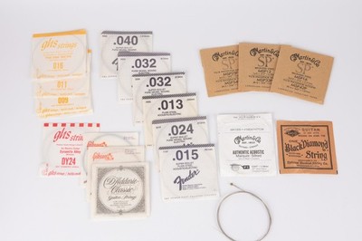 LOT of guitar strings. Electric, and acoustic. Martin, Fender, GHS