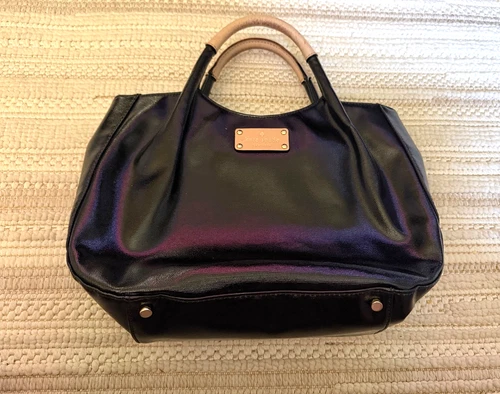 Kate Spade black handbag with beige handle in good condition