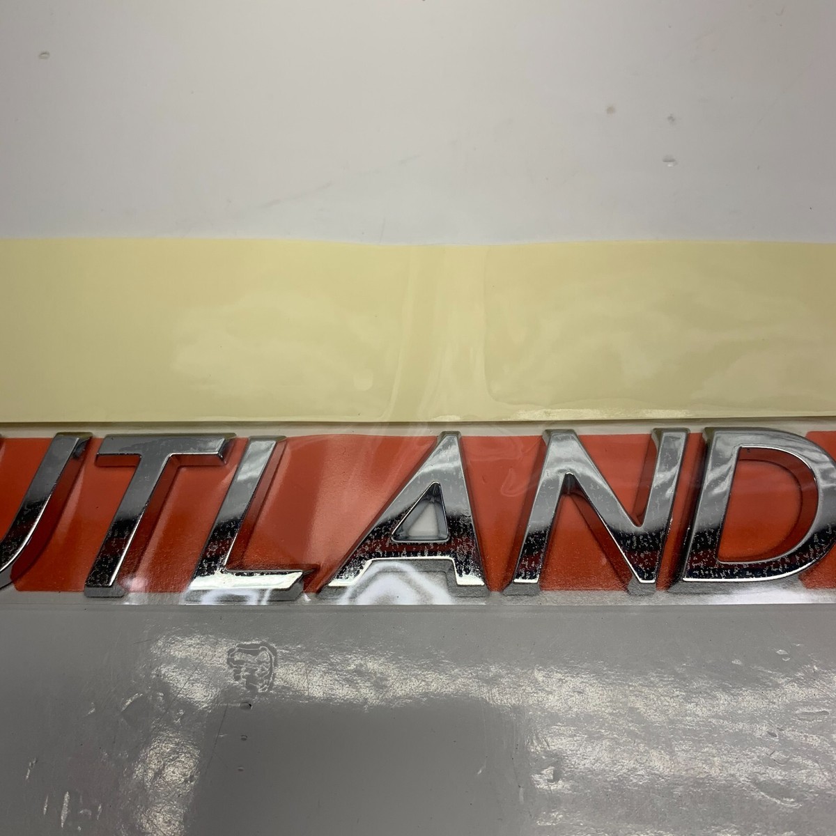 2002 - 2006 Mitsubshi Outlander Rear Left Chrome Emblem MN181569 