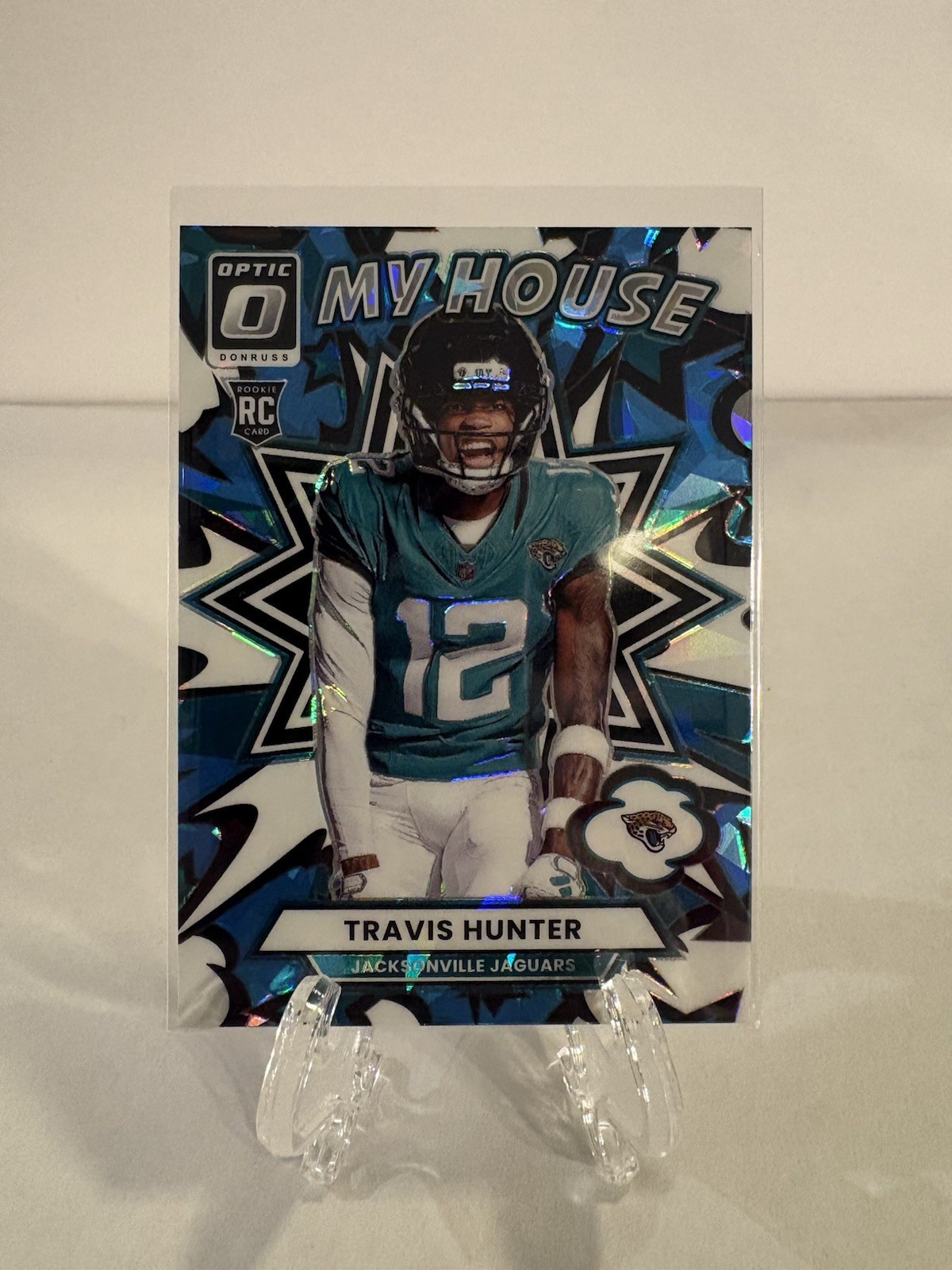 2025 Panini Donruss Optic My House Travis Hunter #3 Blue Ice Prizm /55 (RC) (Z)