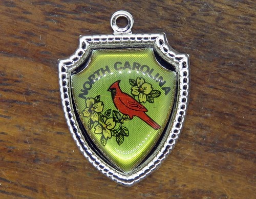 Vintage silver NORTH CAROLINA STATE CARDINAL BIRD TRAVEL SHIELD charm 55-7