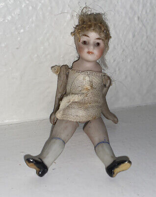 Antique Doll all bisque jointed Brown glass eyes 3 1/2 Antique Doll all bisque jointed Brown glass eyes 3 1/2
