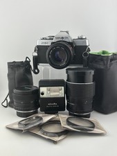 Vintage Minolta XG-1 35 MM Film Camera w/ Multiple Lenses And Accessories