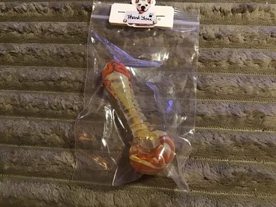 pretty orange and cream colored glass pipe. thick glass. nice pipe.