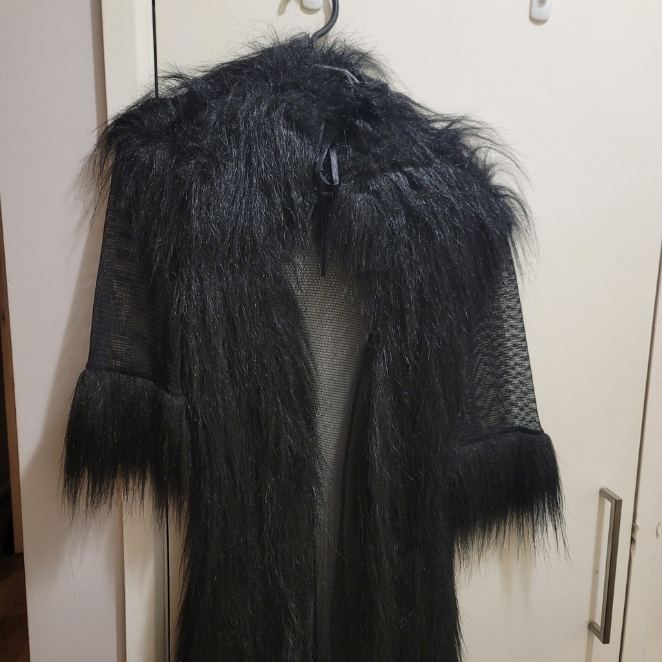 Black net and faux fur long line jacket.
