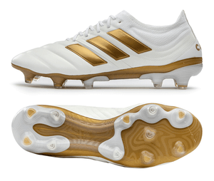 white and gold soccer shoes