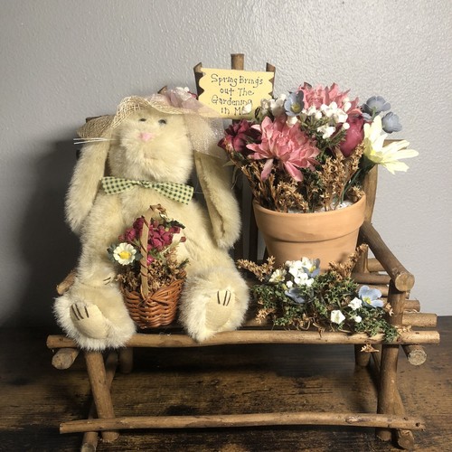 Easter bunny stuffy sitting on a wooden bench with flower - Picture 2 of 11