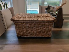 rectangular wicker storage basket featuring two sturdy wooden pole handles
