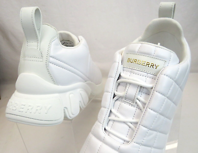$850 BURBERRY AXBURTON WHITE CHECK QUILTED LEATHER LOGO $850 BURBERRY AXBURTON WHITE CHECK QUILTED LEATHER LOGO
