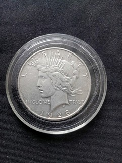 1928s Silver Peace Dollar US Coin in capsule