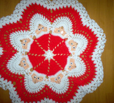 Hand crochet table doily, Santa faces. 23"    a