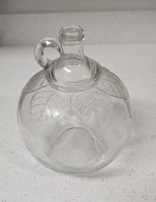 Vintage Laird & Company apple cider jug with.leaf design.