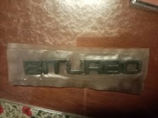 MASERATI BITURBO S-BITURBO Si.  SIGLA  "BITURBO" BRUNITA. IN METALLO. NUOVA