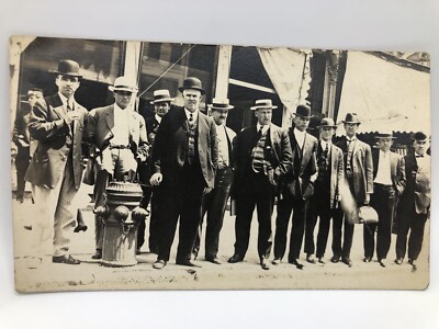 Postcard Men Standing Curbside by Fire Hydrant Wearing Hats Derbys Lansing Mich