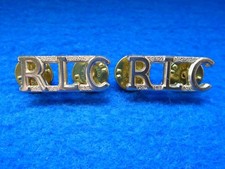 NEW ROYAL LOGISTIC CORPS, RLC, ANODISED SHOULDER TITLES, CLUTCH & PIN FIXINGS