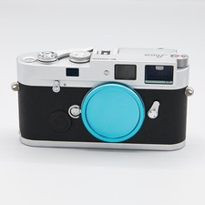 Baby blue colored anodized metal Leica M-mount camera body cap