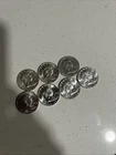 7 UNCIRCULATED FRANKLIN SILVER HALF DOLLARS, 7 DATES FROM 1961-63