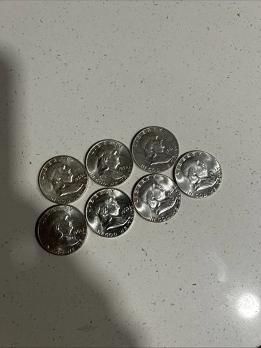 7 UNCIRCULATED FRANKLIN SILVER HALF DOLLARS, 7 DATES FROM 1961-63