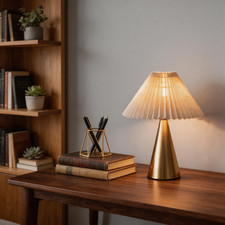 Golden Metal Table Lamp with Pleated Shade for Warm Wooden Nightstand