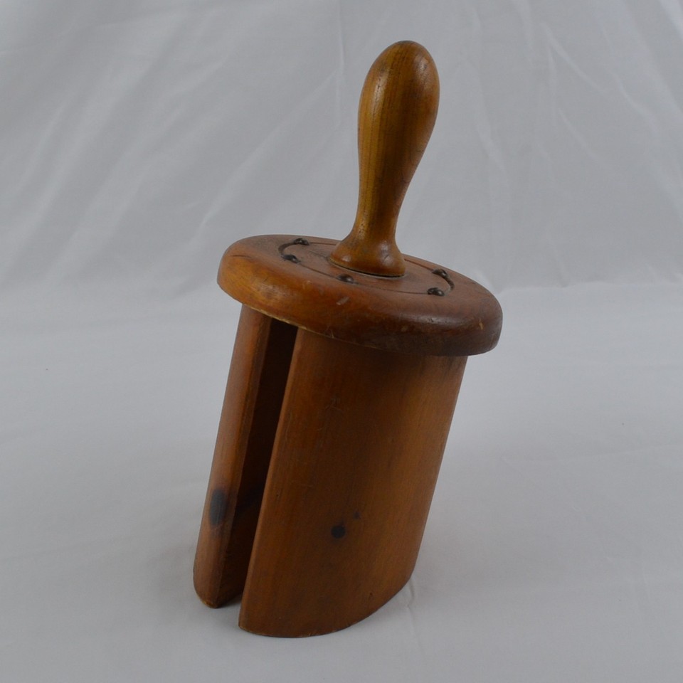 A hand-carved wooden two-jaw clamp with folk art charm — the kind of thing a craftsman made by hand decades ago and no factory will ever replicate.