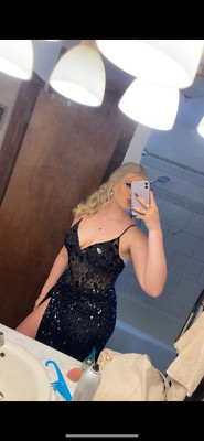 Black prom dress with unique broken glass look with a sequin bottom with a slit.