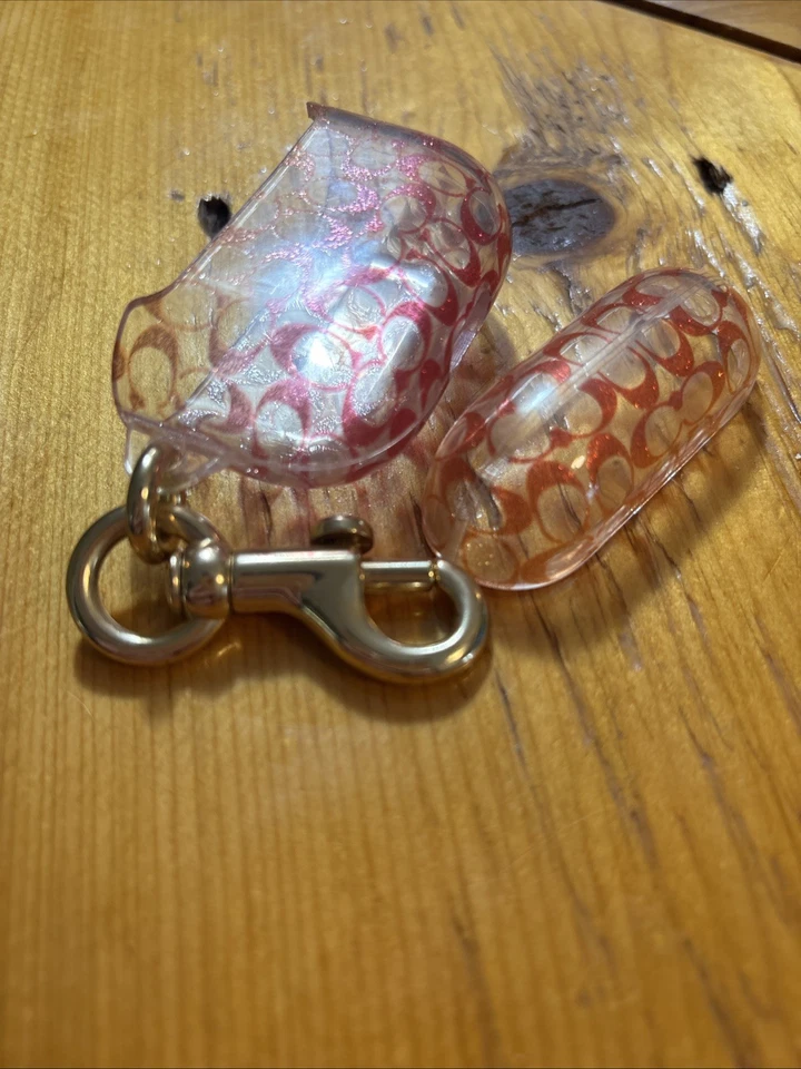 Llavero Estuche AirPods Rosa Naranja y Transparente Logo Coach Foto 3 de 3