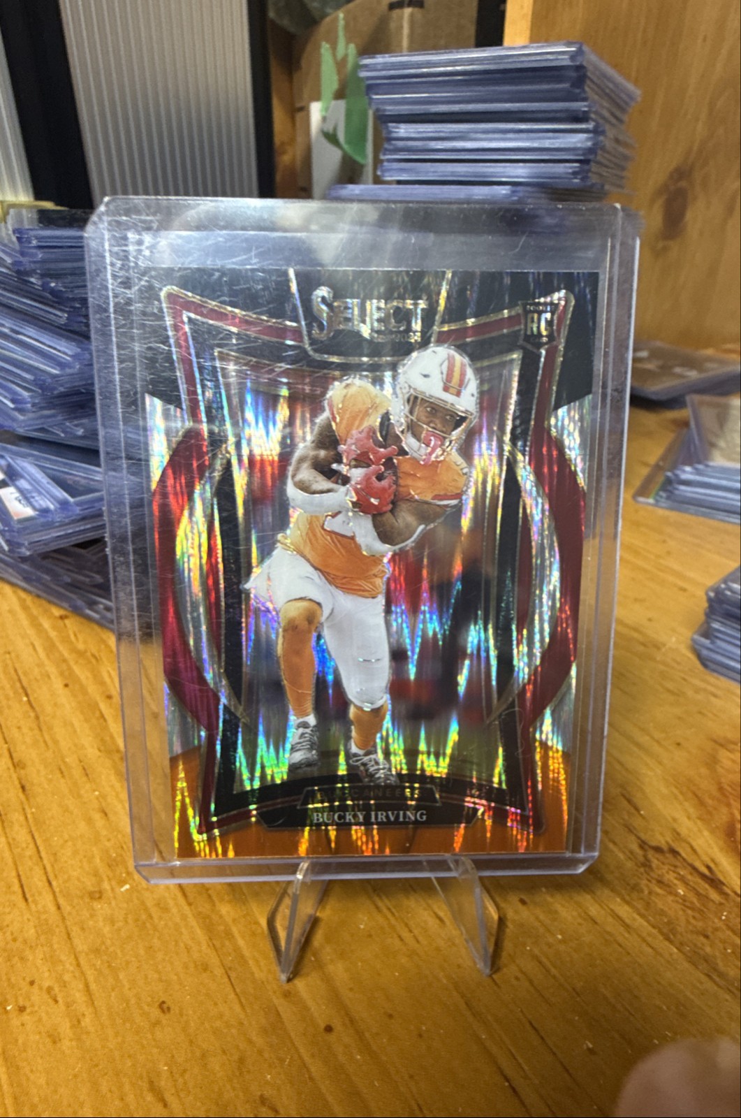 2024 Panini Select - Concourse Bucky Irving #4 Black & Orange Shock Prizm (RC)