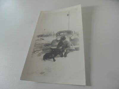 E2-11 Estate photo man with 1940s' car in snow showing off pet dog