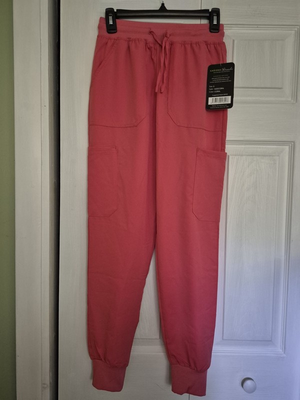 LADIES SCRUB SET SIZE SMALL BY KARISMA CORAL.COLOR  SHORT SLEEVE TOP AND JOGGER