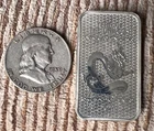 1959 D Franklin Silver Half Dollar and 1 ounce .999 silver bar.