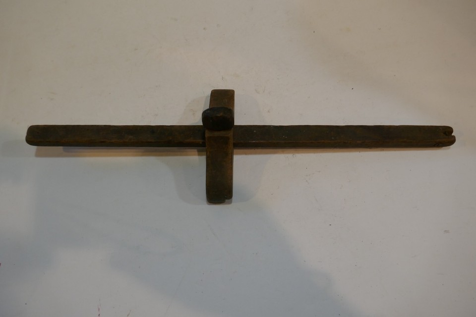 An extra-long wooden mortise marking gauge that's as much a sculptural object as it is a craftsman's precision tool.