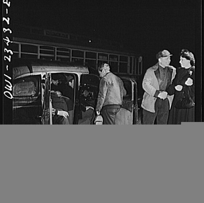 Baltimore, Maryland. Third shift defense workers being picked up by a car pool