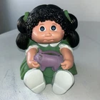 VTG 1983 Cabbage Patch Kids Plastic Piggy Bank Black Hair Blue Eyes Green Dress