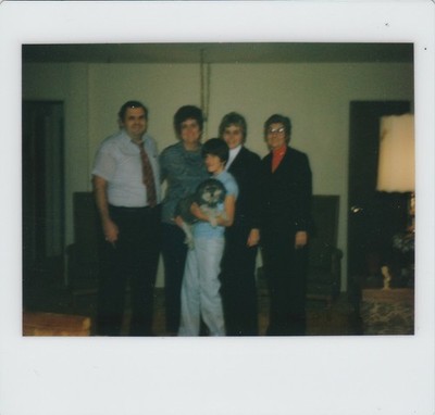 Vintage 1970s Found Photo - Family Smiles And Poses While Young Boy Holds A Dog