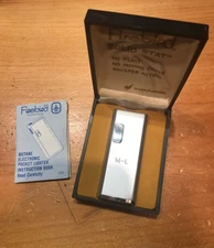 VINTAGE SLIM COLIBRI FIREBIRD LIGHTER WITH CASE & HAS INITIALS M-L ON THE FRONT