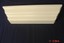 white pressed wood wall shelf 18" across at top and 4" deep.