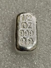 999 SILVER SKULL & CROSSBONES 1/2 TROY OUNCE  LOAF STYLE BAR ATLANTIS MINT