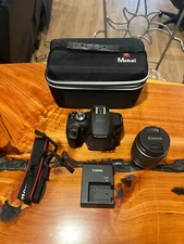 Canon eos rebel t7 camera, 18-55mm lens, battery, strap, and camera bag
