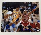 Magic Johnson Signed 16x20 Photo vs Michael Jordan. JSA Authentic Autograph.