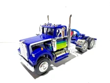 DCP  FIRST GEAR 1/64 SCALE WHITE WESTERN STAR 4900 DAY CAB BLUE, COLORED STRIPES