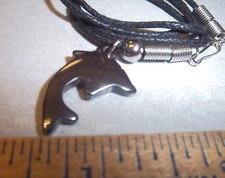 Jumping Dolphin polished metal necklace pendant on cord, dolphin 1 inch tall