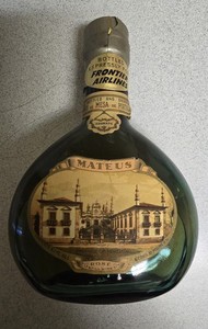 Vintage Green MATEUS ROSE WINE BOTTLE. FRONTIER AIRLINES.