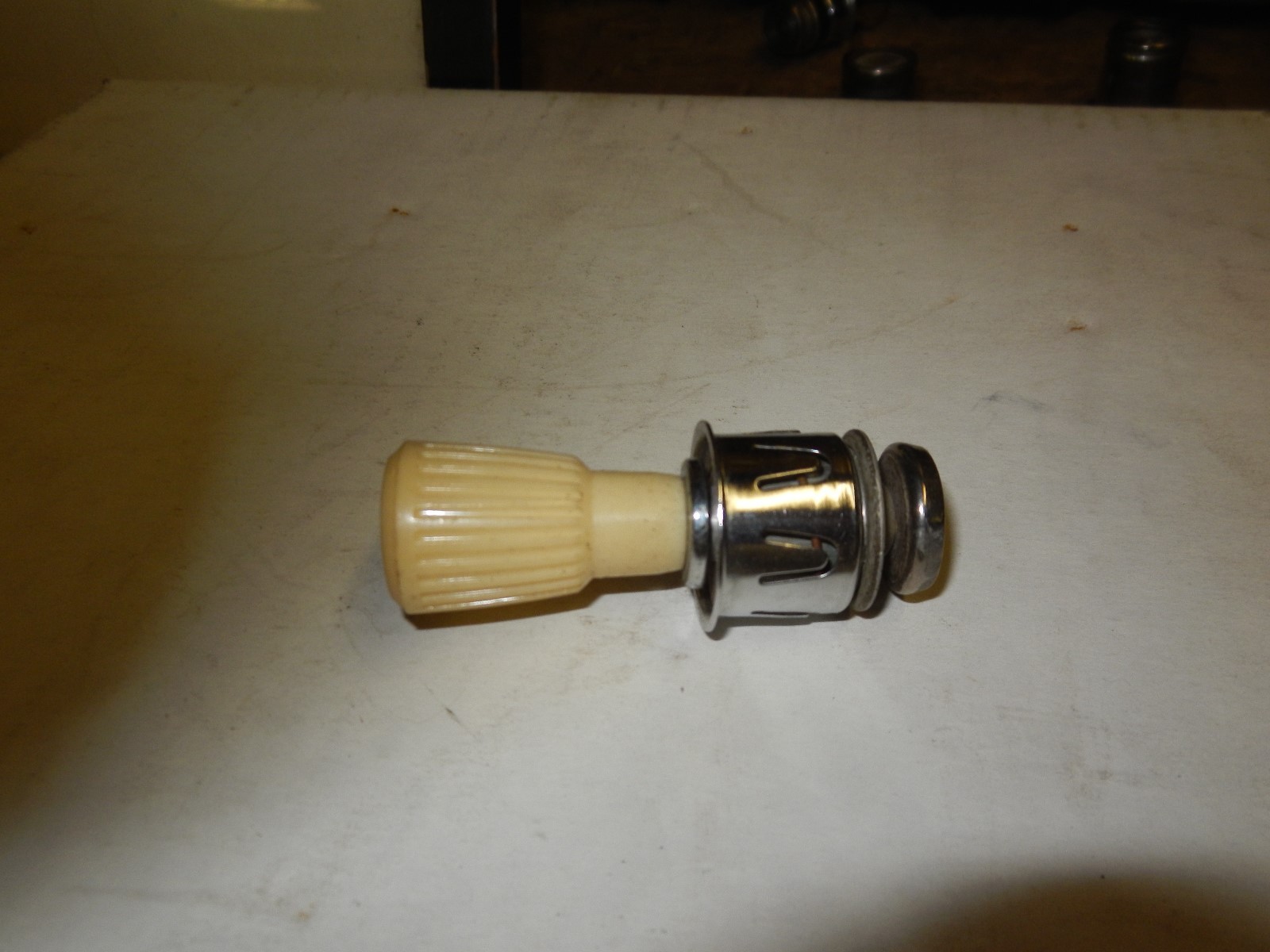 1960'S NOS CUNNO FORD FAIRLANE OFF WHITE 12 V CIGARETTE LIGHTER