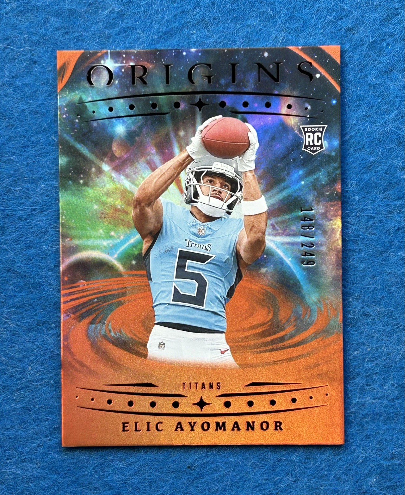 2025 Panini Origins International Elic Ayomanor RC #108 Holo Orange /249 Titans