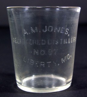 ca1900 PRE PROHIBITION A M JONES WHISKEY EMBOSSED GLASS ADVERTISING SHOT GLASS