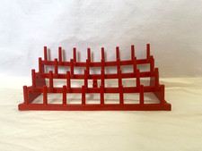 red plastic thread spool self standing, holds...