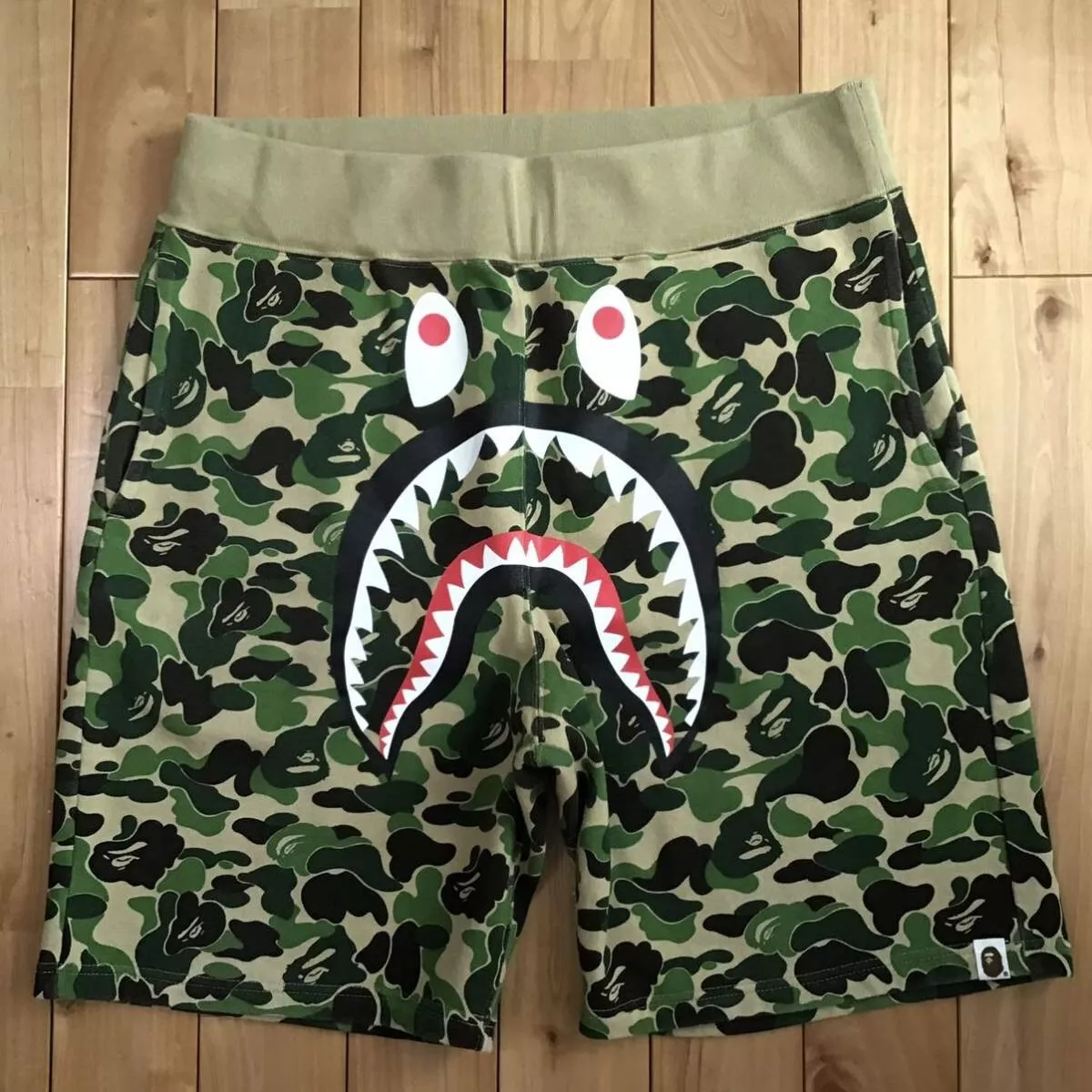 BAPE: Green ABC Camo Shorts