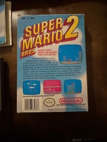 Carro Super Mario Bros 2 NES casi nuevo, caja sello ovalado caja Rev-A y manual (Dmg)