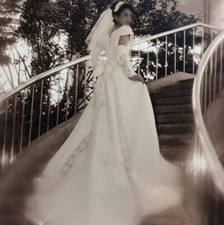 Chic wedding dress with large bow, beautiful train, crown, and 2 gloves