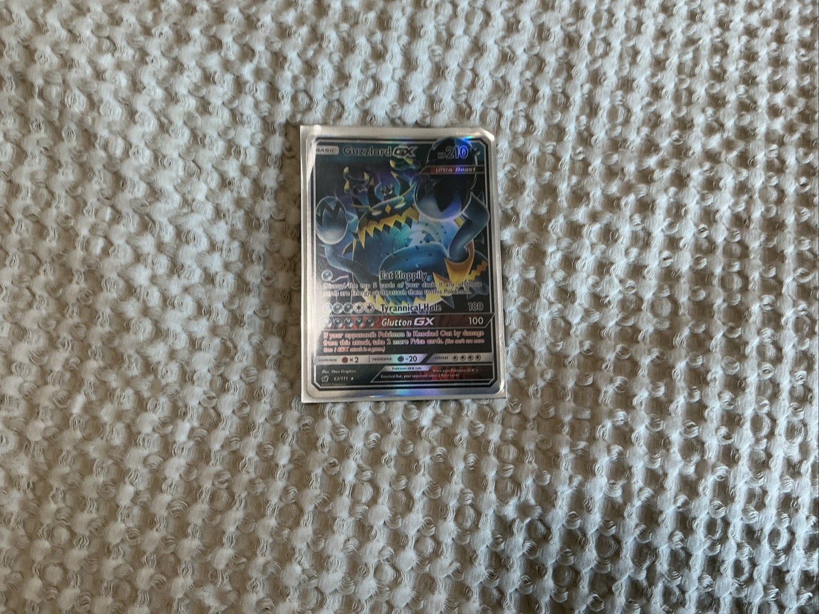 Guzzlord GX 63/111 Sm-Crimson Invasion Holo